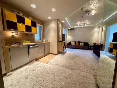 a room with a kitchen and a living room at Apartment Relax Petrovac in Petrovac na Moru