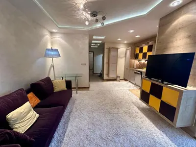 a living room with a couch and a flat screen tv at Apartment Relax Petrovac in Petrovac na Moru