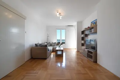 a living room with a couch and a television at Katarina17 in Becici