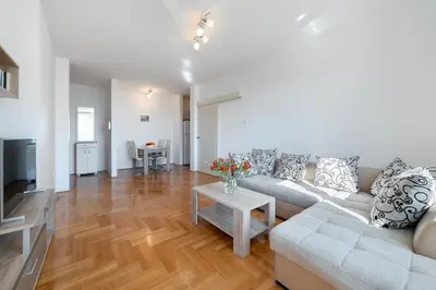 a living room with a couch and a table at Katarina17 in Becici