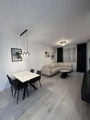 a living room with a couch and a table at Ponte Nuovo De Luxe Apartment in Ulcinj