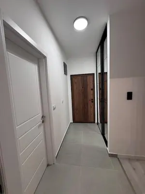 an empty hallway with a door and a hallwayngth at Ponte Nuovo De Luxe Apartment in Ulcinj