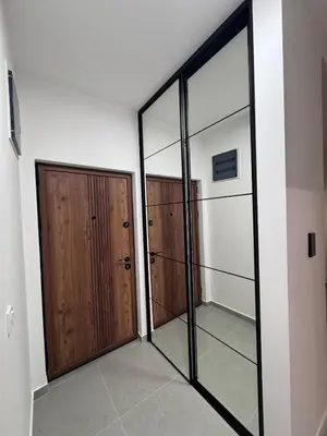 a room with two doors and two mirrors at Ponte Nuovo De Luxe Apartment in Ulcinj