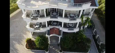 an aerial view of a large white building at OliveGarten Apartments in Ulcinj