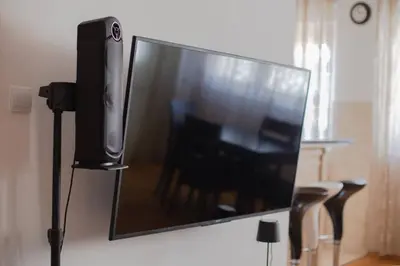 a flat screen tv sitting on top of a wall at SOHO CITY Grunevs apartments 2 in Bar