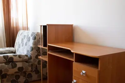 a desk and a chair in a room at SOHO CITY Grunevs apartments 2 in Bar