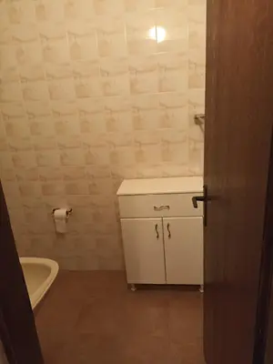 a bathroom with a toilet and a sink and a tub at Vila Marina in Buljarica