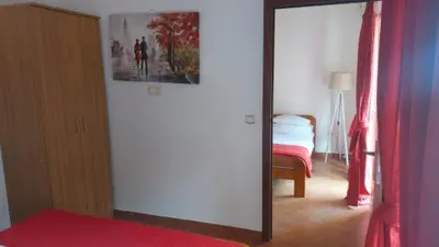 a mirror in a room with a bed and a bedroom at Vila Marina in Buljarica