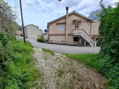 a house on the side of a road at Nina Apartment in Škaljari