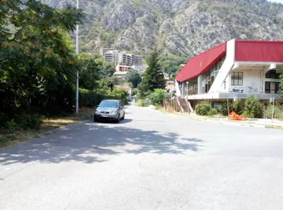 a car parked on the side of a road at Nina Apartment in Škaljari