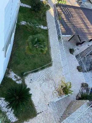 an overhead view of a garden with plants on the ground at Biser mora in Dobra Voda