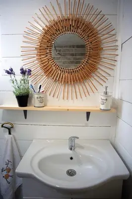 a bathroom with a sink and a mirror on a shelf at Suncica Ada Bojana in Ada