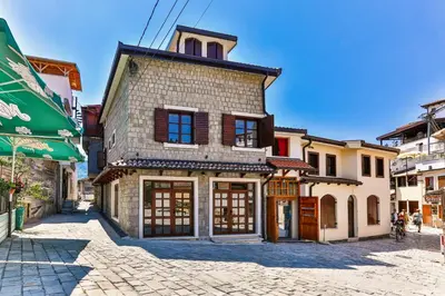 an old building on a street in a city at Olea Apartments in Stari Bar