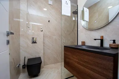 a bathroom with a sink and a shower with a mirror at Villa Aurora Azure - Luxury Infinity Pool Resort in Katun