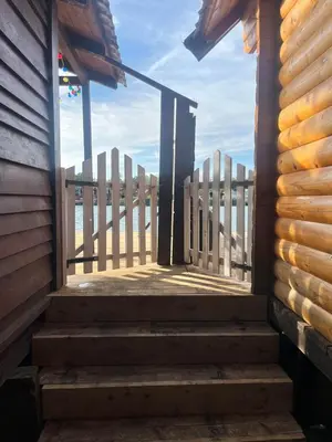 a stairway leading up to a building with a fence at Zvoncica, Ada Bojana in Ada