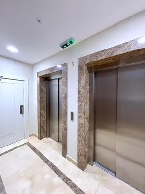 a row of elevator doors in a building at Luxe Beachfront Stay in Bečići with Pool in Budva