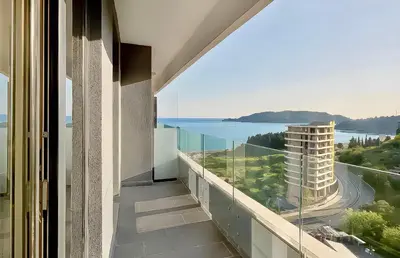 a balcony with a view of the water at Luxe Beachfront Stay in Bečići with Pool in Budva