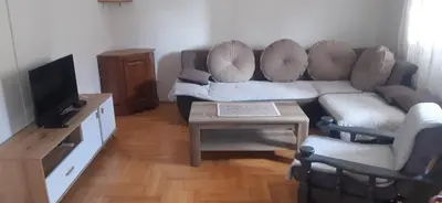 a living room with a couch and a table at Apartman Marko in Podgorica