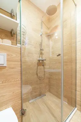 a shower with a glass door in a bathroom at Aurora Apartment 1 with Parking in Budva