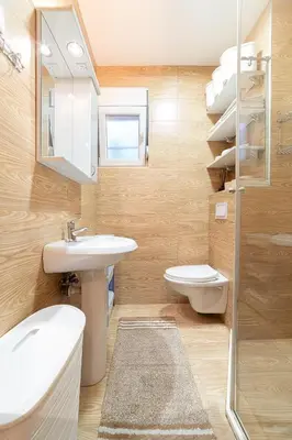 a bathroom with a sink and a toilet and a shower at Aurora Apartment 1 with Parking in Budva
