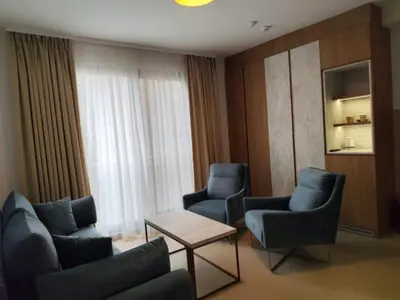 a room with chairs and a table and a window at Urban apartments Sutomore in Sutomore