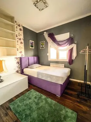 a bedroom with two beds and a window at Charming Countryside Villa with Garden & Terrace near Skadar Lake in Berislavci