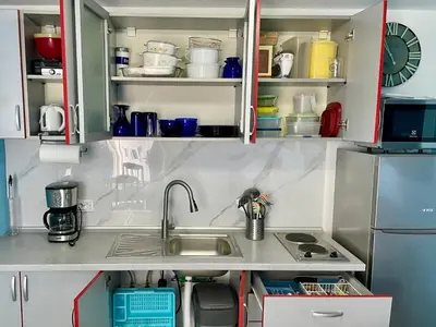 a kitchen with a sink and a refrigerator at Sutomore Panorama Studio in Sutomore