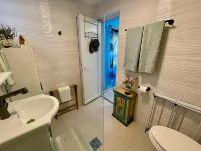 a bathroom with a sink and a toilet and a shower at Sutomore Panorama Studio in Sutomore