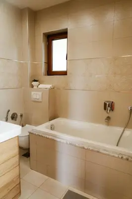 a bathroom with a tub and a toilet and a sink at Villa Mia in Kotor