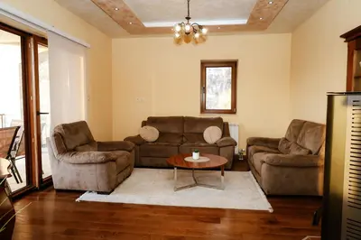 a living room with two couches and a table at Villa Mia in Kotor
