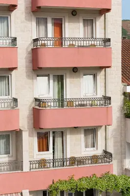 a building with balconies on the side of it at Apartments Ivona in Budva