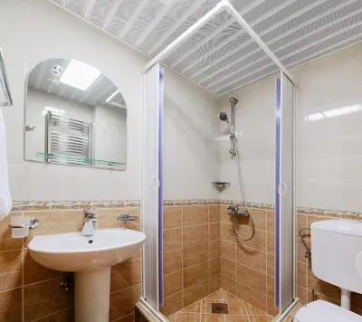 a bathroom with a sink and a shower at Apartments Ivona in Budva
