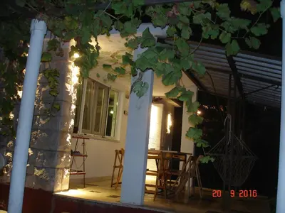 a front porch of a house at night at Vintage Summer House in Budva
