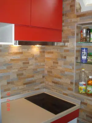 a kitchen with a sink and a red cabinet at Vintage Summer House in Budva
