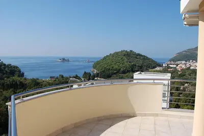 a balcony with a view of the water at Villa Nova Premium Apartment No 7 in Petrovac na Moru