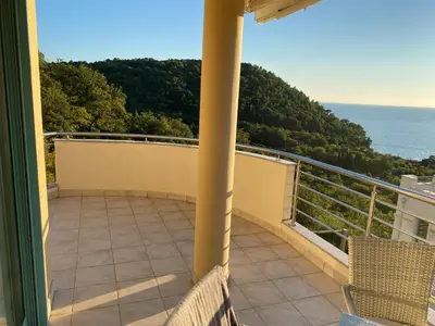 a balcony with a view of the ocean at Villa Nova Premium Apartment No 7 in Petrovac na Moru