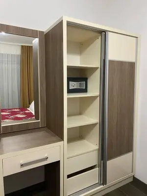 a closet with a mirror and a microwave in it at Aria Apartman 1 Ulcinj in Ulcinj