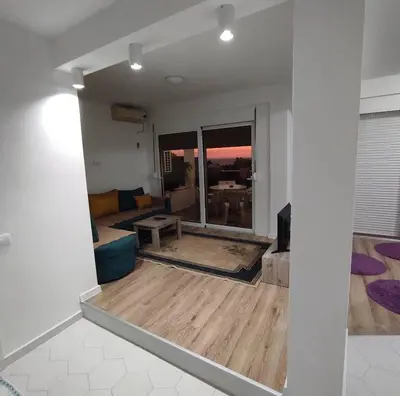 a living room with a couch and a table at Mediterano Apartments in Ulcinj
