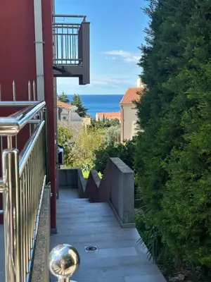 a balcony of a house with a view of the ocean at Happy Time Studio in Petrovac na Moru