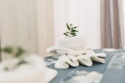 a pile of towels sitting on top of a table at Eman Resort & Villas in Ulcinj