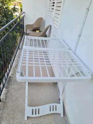 a white bed sitting on top of a balcony at Casa-Cristiano in Sutomore