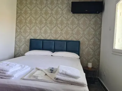 a bedroom with a bed with towels on it at Casa-Cristiano in Sutomore