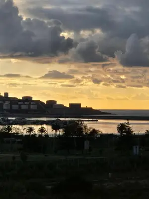 a sunset over a body of water with buildings at Seratlić Lux 27 in Bar