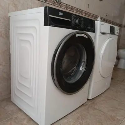 a white washing machine sitting in a bathroom at Kolovic Susanj in Bar