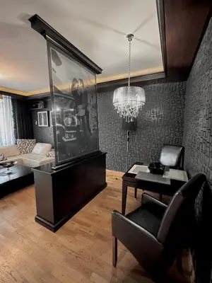 a living room with a couch and a table at Апартаменти Будва in Budva