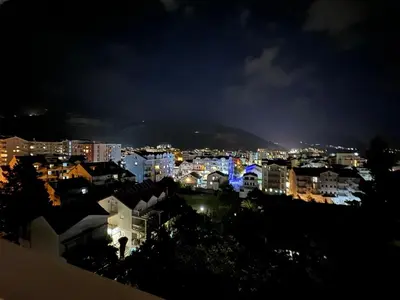 a view of a city at night at Апартаменти Будва in Budva