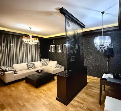 a living room with a couch and a table at Апартаменти Будва in Budva