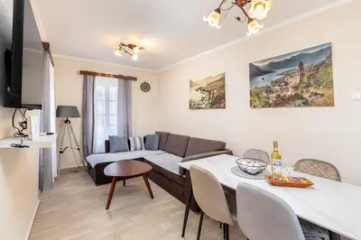 a living room with a couch and a table at Apartment NICO in Kotor