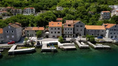 an aerial view of a marina with boats in the water at Historic Waterfront House in Muo