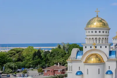 a building with a gold domicism on top of it at Adriatic Lux Apartment in Bar